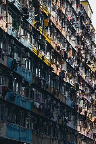 high rise architectural photography of blue and yellow house urban